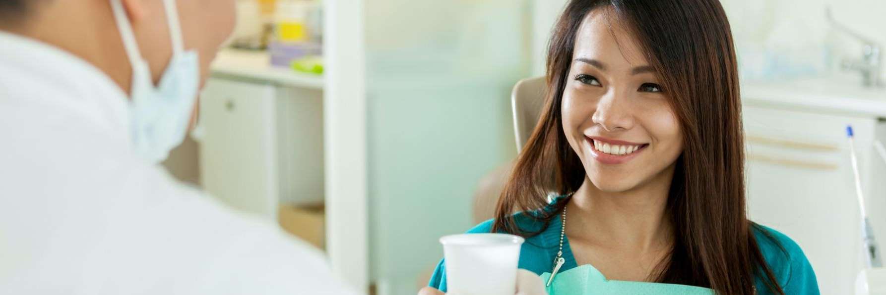 A happy young woman during Dental Exam in Maple Ridge, BC