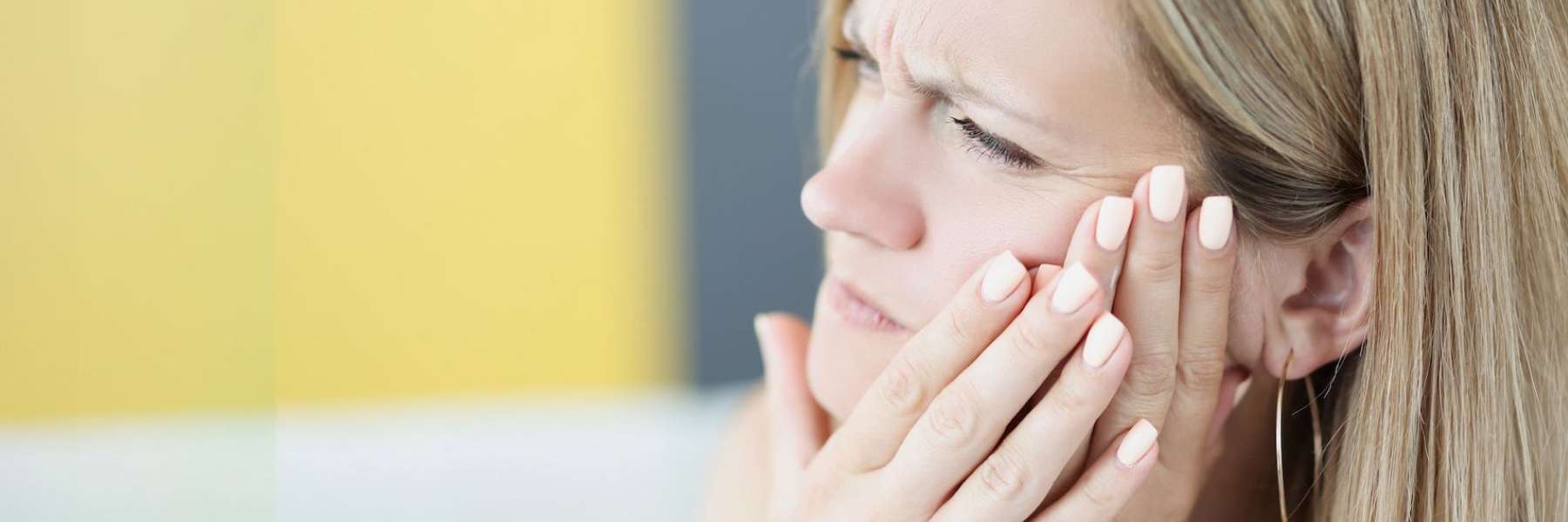 A young in pain before an Emergency Dentist visit in Maple Ridge, BC