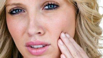A woman with Emergency dentistry in Maple Ridge, BC