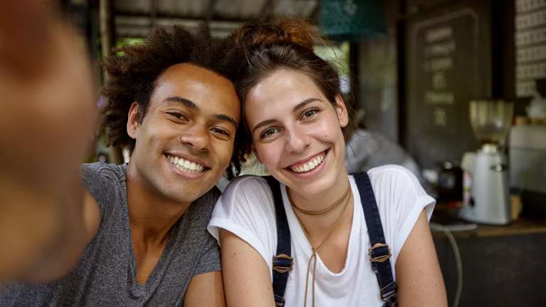 People smiling at a coffee shop | Dental filling Maple ridge