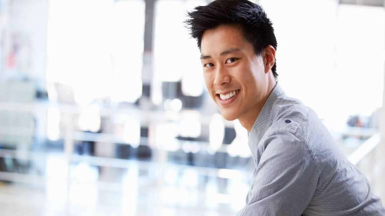 An man of asian origin with teeth implants in Maple Ridge