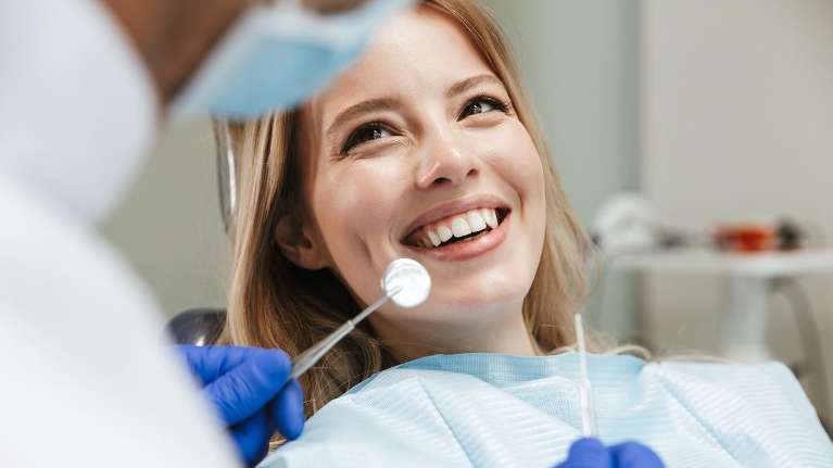 A patient after getting dental implant in Maple Ridge, BC