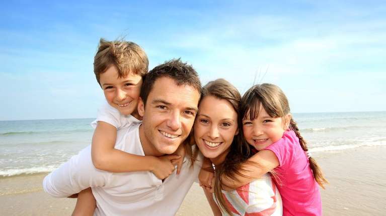 A family smiling at the beach | best Maple Ridge dentist