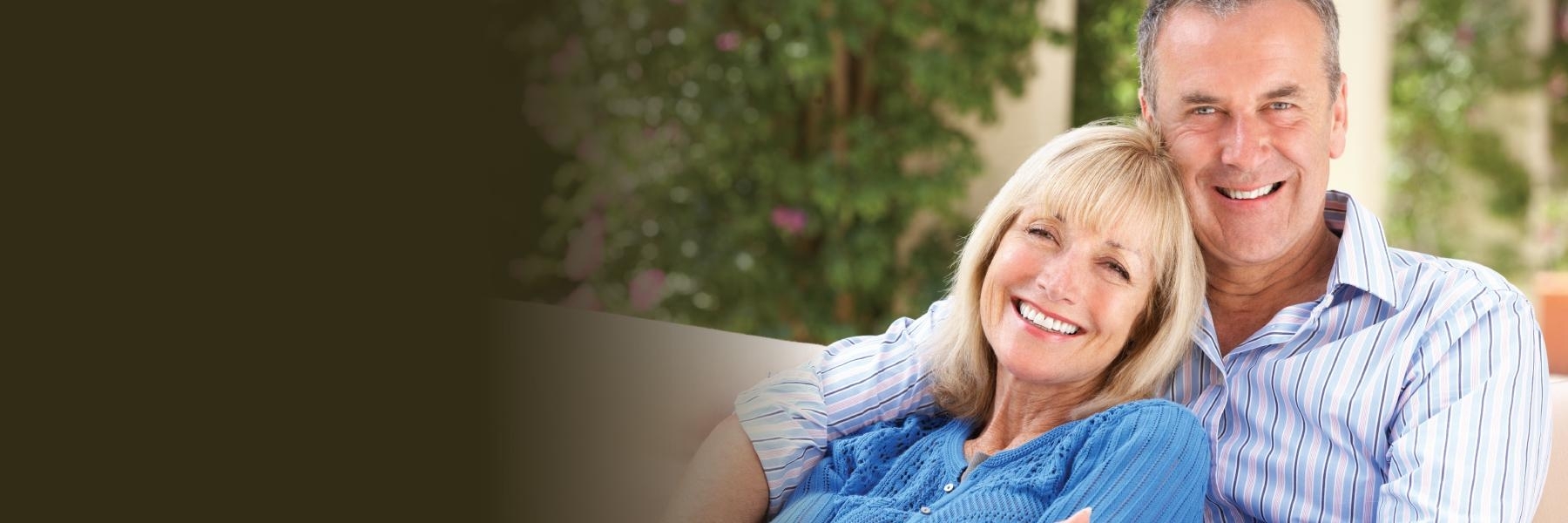 Older couple smiling | dental implants Maple Ridge