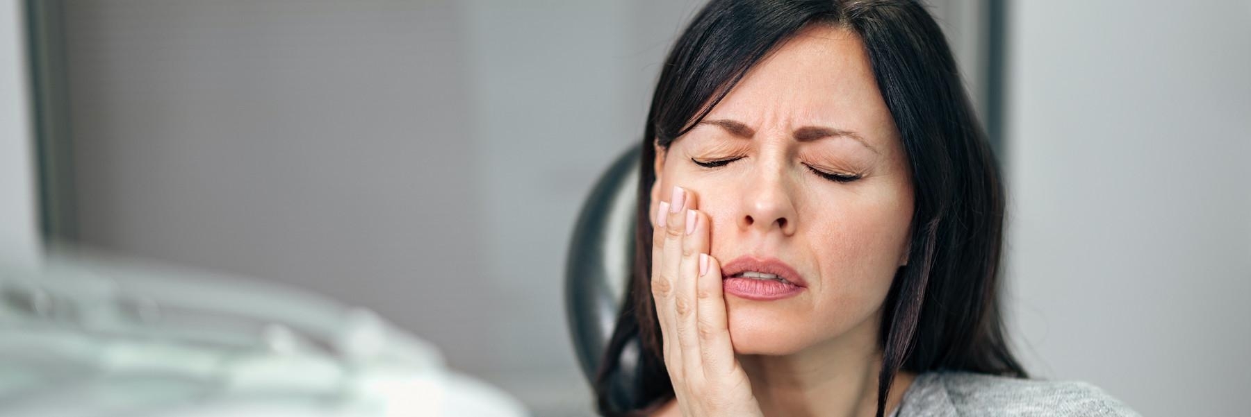 A woman with tooth pain